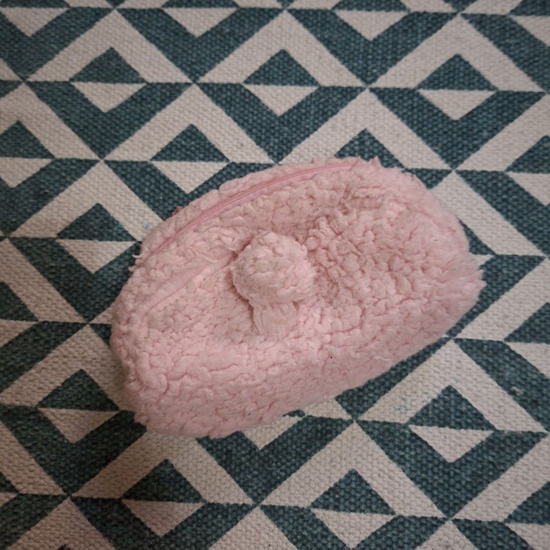 My Melody Pink Plush makeup pouch (Category: Purses & Pouches) located in Manila. Submitted by fandh_essentials (Listing ID 1429586288, Image 2). Description: Adorable My Melody plush pouch in a soft pink color. Features a cute bow detail and a zipper closure. The interior is lined with a My Melody print. Perfect for storing small items like cosmetics or accessories. A charming and functional accessory for any My Melody fan..