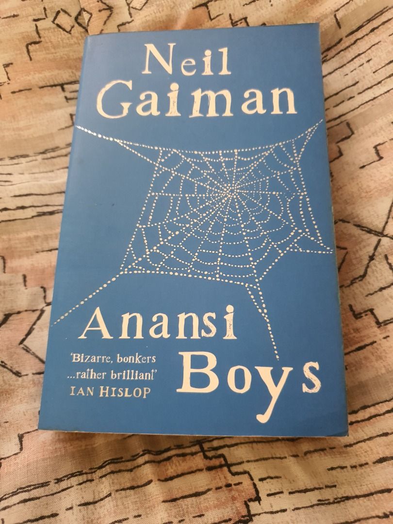 Neil Gaiman Anansi Boys (Category: Storybooks) located in Quezon City. Submitted by cuiquesuum (Listing ID 1429554407, Image 1). Description: Foxing spots and tanned oxidation to the pages. The binding is secure. There is a 2-line writing on the first page by the previous owner. Cover is intact but shows clear, noticeable wear, such as scuffs, minor creases, or edge wear. It is in perfectly readable condition. .