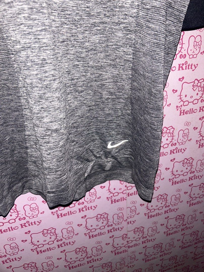 Nike Gray Short Sleeve Shirt (Category: Blouses) located in Manila. Submitted by hellokitty_21 (Listing ID 1429619197, Image 2). Description: Women running top, original nike.