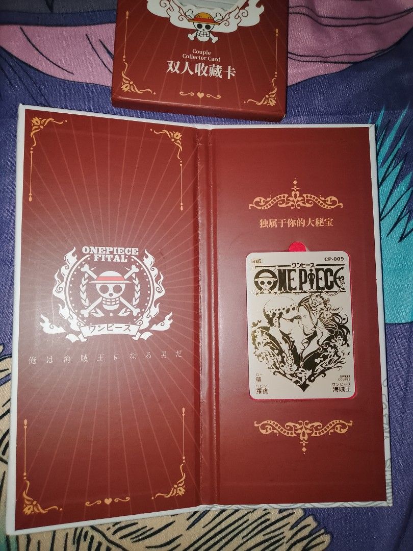 One Piece Couple NUMBERED Collector Card (Category: Raw Singles) located in Manila. Submitted by epicgem.363b7b (Listing ID 1429612811, Image 3). Description: One Piece Couple Collector Card. The card features the One Piece logo and characters. The packaging is red and gold with Chinese text. The card is in a protective case..