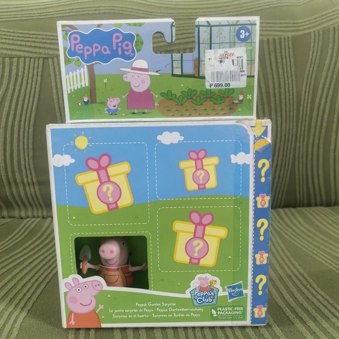 Peppa Pig Surprise Garden Playset (Category: Kids Toys) located in Manila. Submitted by kenslie (Listing ID 1429536669, Image 1). Description: Peppa Pig playset features a surprise garden theme. It includes a Peppa Pig figure with gardening tools and several surprise gift boxes. The packaging indicates it's suitable for ages 3+. The box also shows a picnic scene with Peppa Pig and her family. It is a plastic-free packaging..