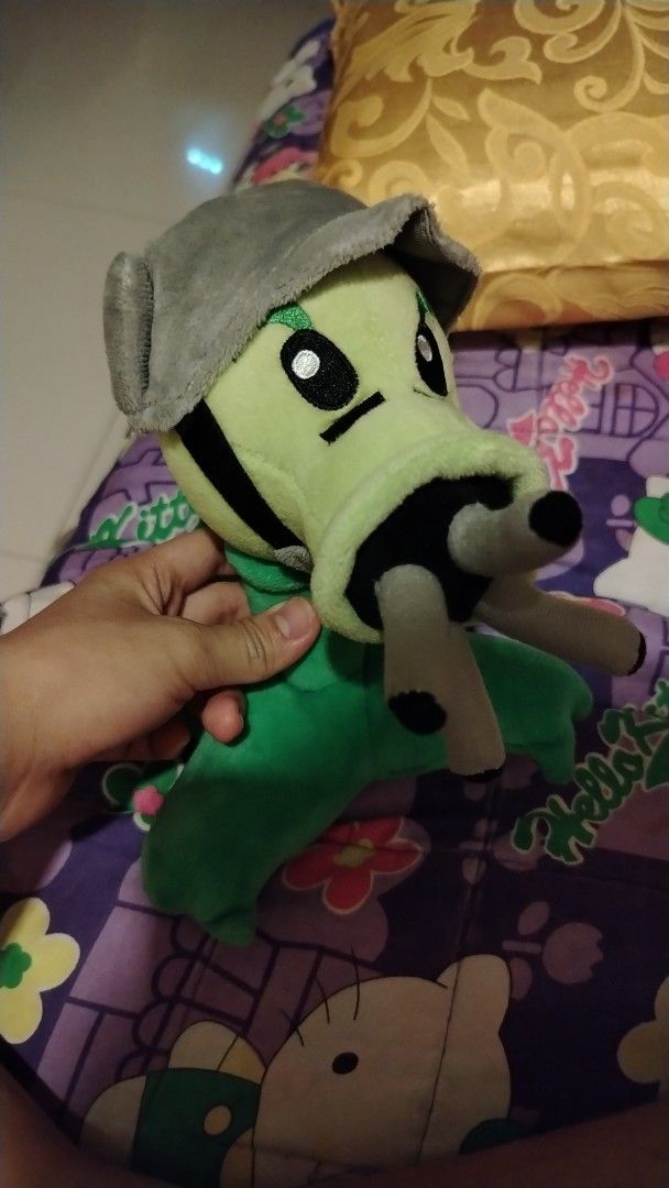Plants vs. Zombies Plush Toys set 3pcs (Category: Plushies & Soft Toys) located in Cavite. Submitted by xnyukina (Listing ID 1429603182, Image 3). Description: Set of three Plants vs. Zombies plush toys. Includes a Peashooter with a helmet, a Sunflower, and a Banana. The Banana plush has a tag that says "All New Material, 80% Cotton, 20% Polyester, Made in China"..