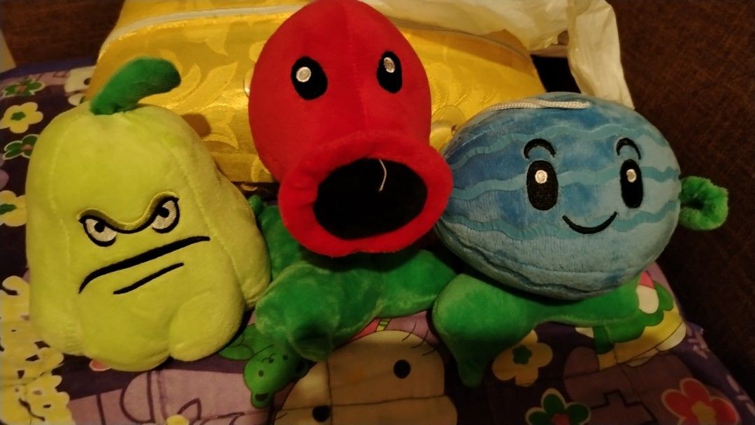Plants vs. Zombies Plush Toys Set (Category: Plushies & Soft Toys) located in Cavite. Submitted by xnyukina (Listing ID 1429605205, Image 1). Description: Listing includes a set of three Plants vs. Zombies plush toys. The set features a Peashooter, a Wall-nut, and a Watermelon. Each plush toy has detailed embroidery and vibrant colors. They are soft and cuddly, perfect for fans of the game or as a gift. These plush toys are great for display or p