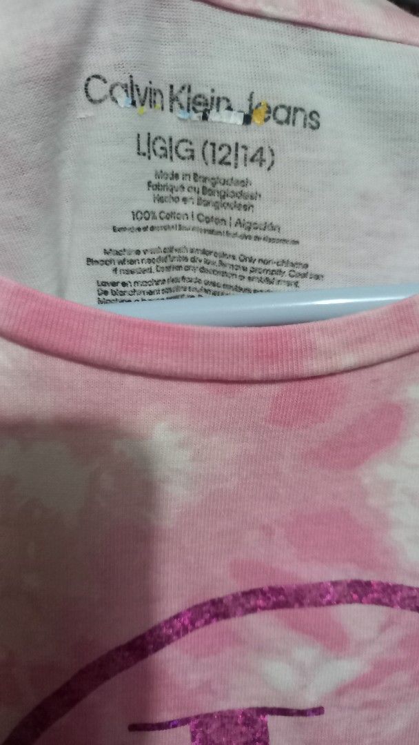 Preloved Tie-Dye shift dress for kids (Category: Babies & Kids Fashion) located in Caloocan City. Submitted by httyt.45 (Listing ID 1429665367, Image 3). Description: • shift dress (A-line cut) • pink tie-dye design with the brand's logo on the front. • size L/G (12/14) on tag runs smal may fit 7-10 years old • made of 100% cotton • short sleeves and a round neckline..