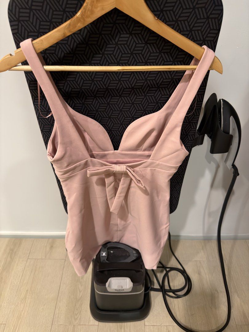 Short Elastic Dress with Bow (Category: Dresses) located in Mabalacat. Submitted by letsirkmd (Listing ID 1429628668, Image 2). Description: Short, elastic dress in a light pink color. It features a V-neckline and a bow detail at the back. The dress has a fitted silhouette. The dress has a simple, elegant design suitable for various occasions..