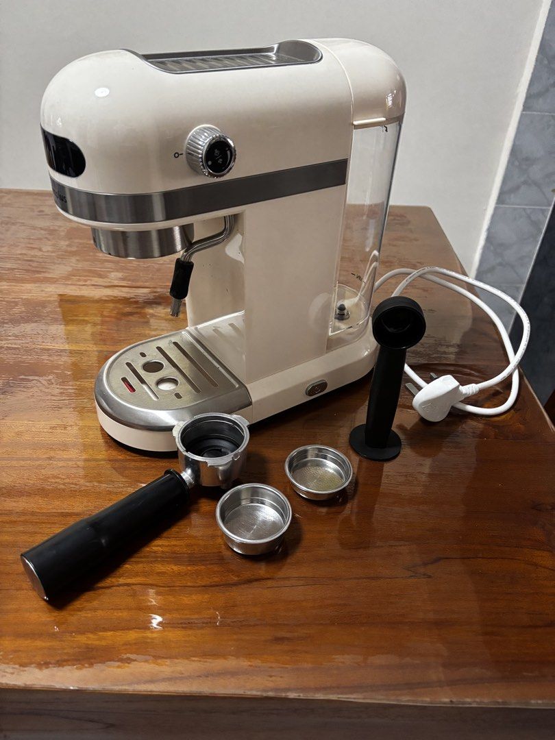 Simplus Semi-Automatic Espresso Machine (Category: Coffee Machines & Makers) located in Singapore. Submitted by elmolek (Listing ID 1429520509, Image 1). Description: Cream-colored Simplus espresso machine. Includes portafilter, filter baskets, and tamper. Features a steam wand for frothing milk. Water reservoir is visible. In good working condition. Purchased at $99.