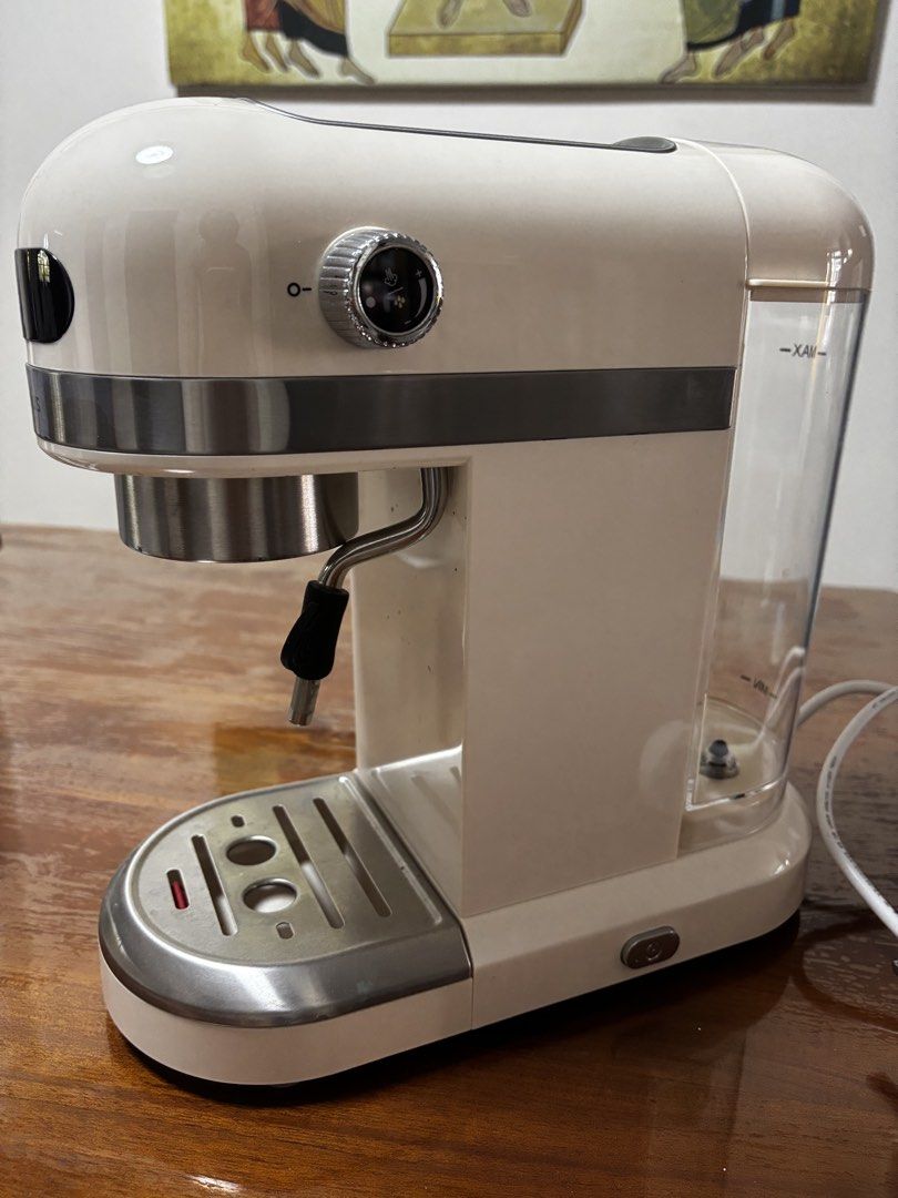 Simplus Semi-Automatic Espresso Machine (Category: Coffee Machines & Makers) located in Singapore. Submitted by elmolek (Listing ID 1429520509, Image 3). Description: Cream-colored Simplus espresso machine. Includes portafilter, filter baskets, and tamper. Features a steam wand for frothing milk. Water reservoir is visible. In good working condition. Purchased at $99.