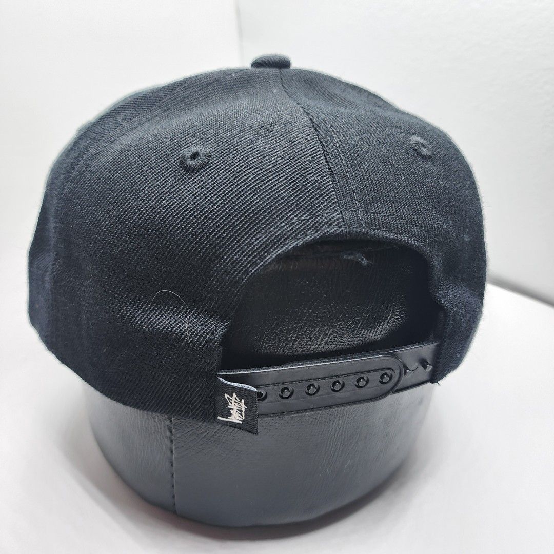 Stussy Embroidered Cap (Category: Caps & Hats) located in Quezon City. Submitted by randomthangz (Listing ID 1429577685, Image 3). Description: Stussy cap features an embroidered logo on the front. It has a black body with a white logo and a black adjustable strap at the back. The cap includes a Stussy tag inside with the text "Have a Good Vibe!"..