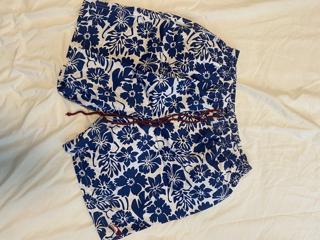 Swim Shorts x2 (Category: Swim Trunks & Board Shorts) located in Makati City. Submitted by rye16 (Listing ID 1429563262, Image 3). Description: - Two pairs of Concorso swim shorts - Size: Large - Includes: - White shorts with rainbow stripe waistband - Blue floral shorts.