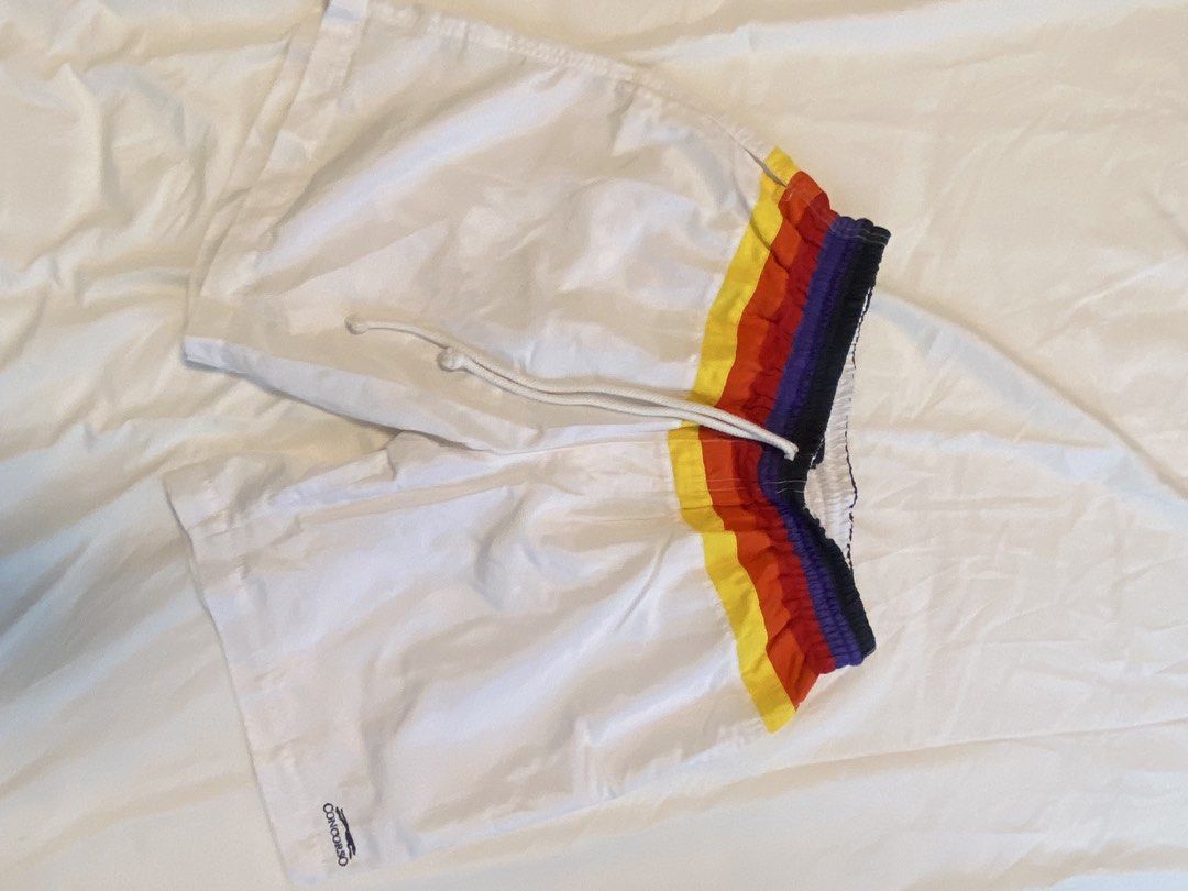 Swim Shorts x2 (Category: Swim Trunks & Board Shorts) located in Makati City. Submitted by rye16 (Listing ID 1429563262, Image 1). Description: - Two pairs of Concorso swim shorts - Size: Large - Includes: - White shorts with rainbow stripe waistband - Blue floral shorts.