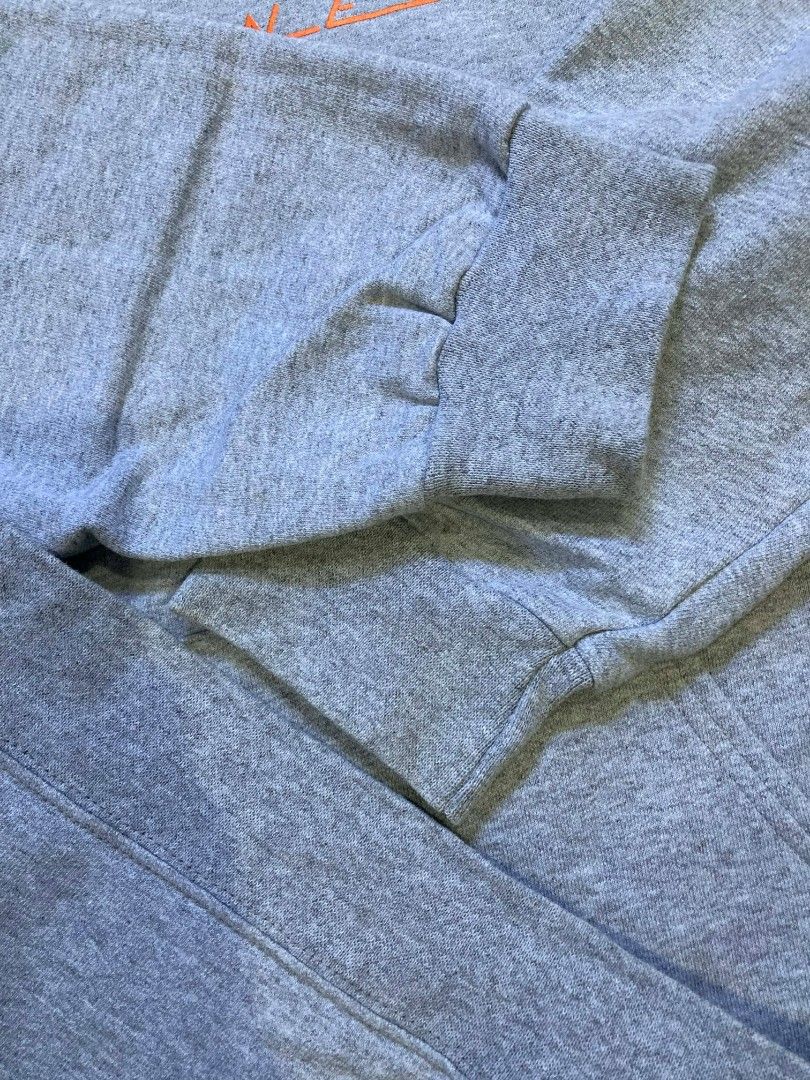 Thrasher Magazine Hoodie - Gray (Category: Hoodies) located in General Santos City (Dadiangas). Submitted by amorhesthrift (Listing ID 1429536408, Image 3). Description: W25.5 L28 Gray Thrasher Magazine hoodie. Features the iconic Thrasher logo on the front. It has a hood with drawstrings and a kangaroo pocket. The tag indicates it is a size L (42-44). Made in Honduras. The material is 85% cotton and 15% polyester..