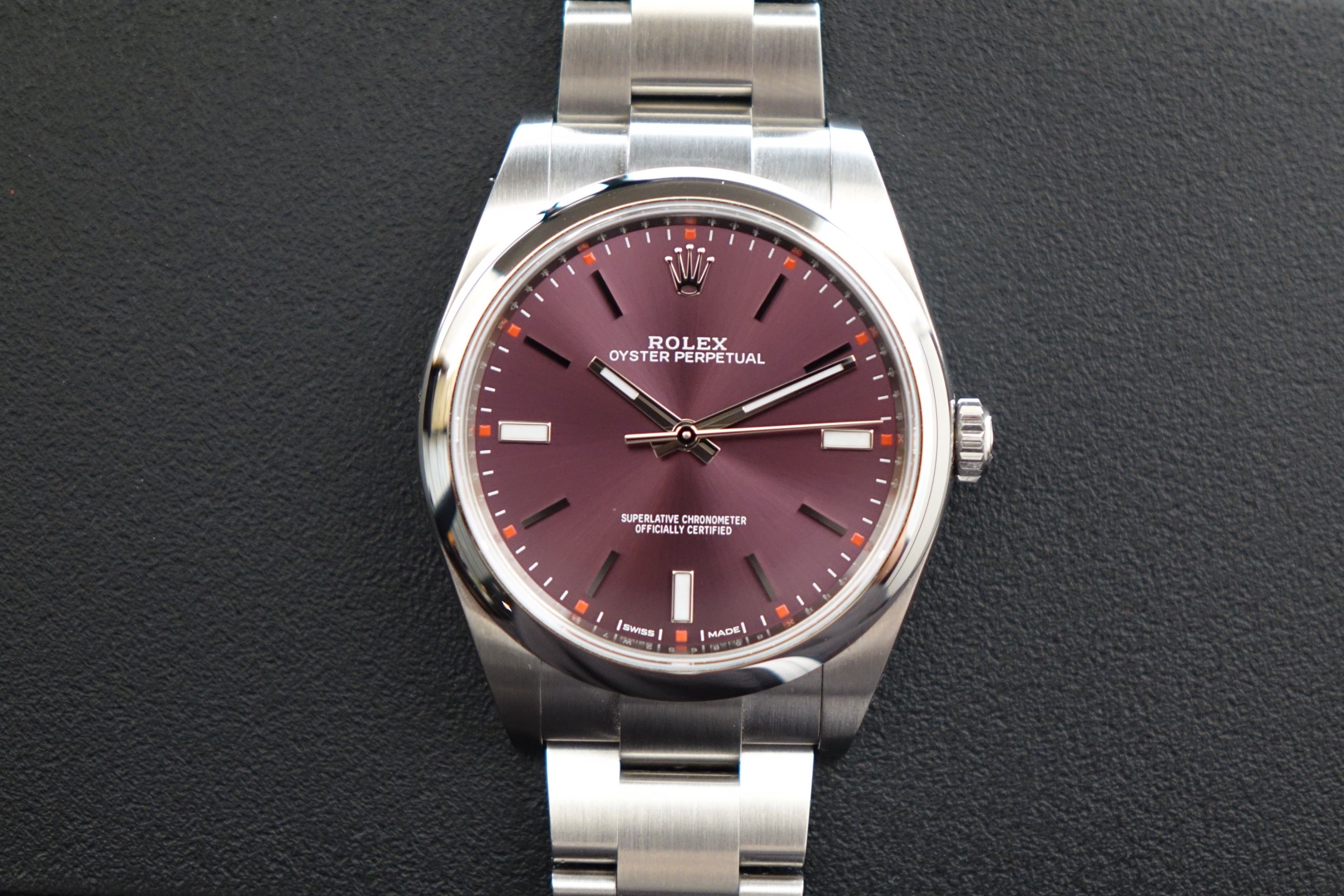 Unpolished 2019 Rolex Oyster Perpetual 39 114300 grape (Category: Watches) located in Singapore. Submitted by wristime (Listing ID 1429649546, Image 1). Description: Join our tele-gram channel for the latest updates! https://bit.ly/4rwZ2Mp The OP 39 Grape is one of the most distinctive executions from Rolex’s modern OP lineup, combining classic simplicity with a bold, unmistakable dial. The rich grape hue shifts beautifully under light, ranging f