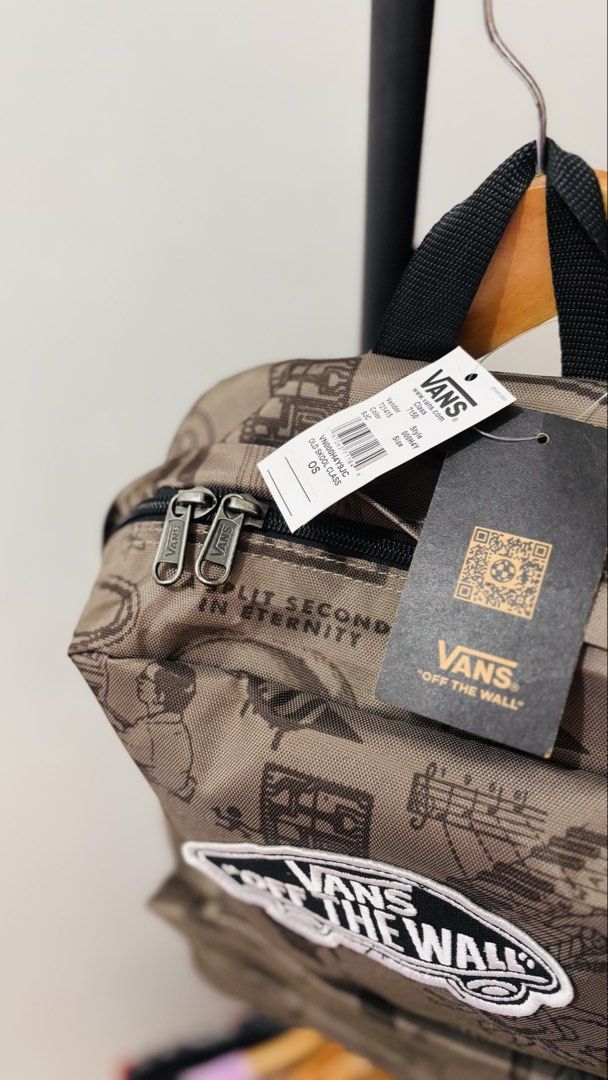 Vans Old Skool Class Backpack (Category: Backpacks) located in Binan City. Submitted by worldofthrift1001 (Listing ID 1429602730, Image 2). Description: Vans backpack features a unique graphic design. It has a main compartment and a front pocket. The backpack includes a top handle and adjustable shoulder straps. The zippers have the Vans logo. The interior has a label with the Vans logo and product information..