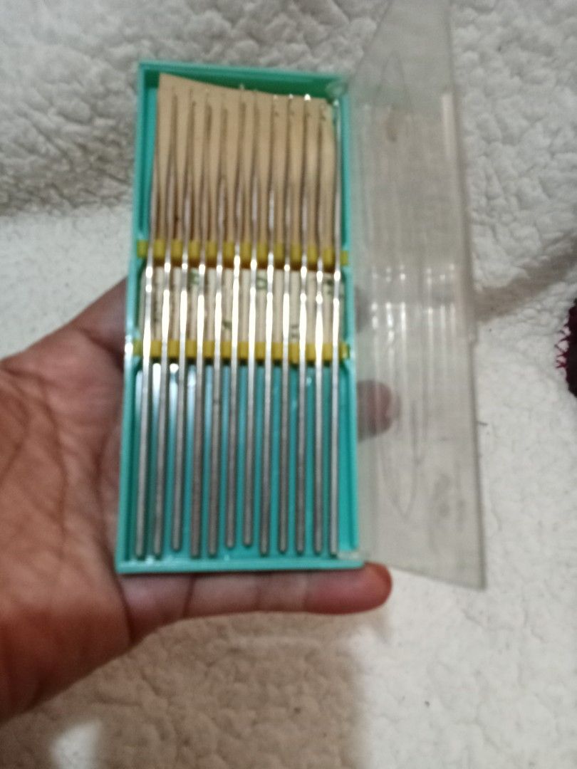 Vintage Crochet Hook Set (Category: Craft Supplies & Tools) located in Bocaue. Submitted by marajapansurplus (Listing ID 1429548671, Image 3). Description: Vintage set of crochet hooks. The set includes multiple hooks of varying sizes, neatly organized in a green plastic case with a clear lid. The case has a yellow band to hold the hooks in place. Perfect for crochet enthusiasts..