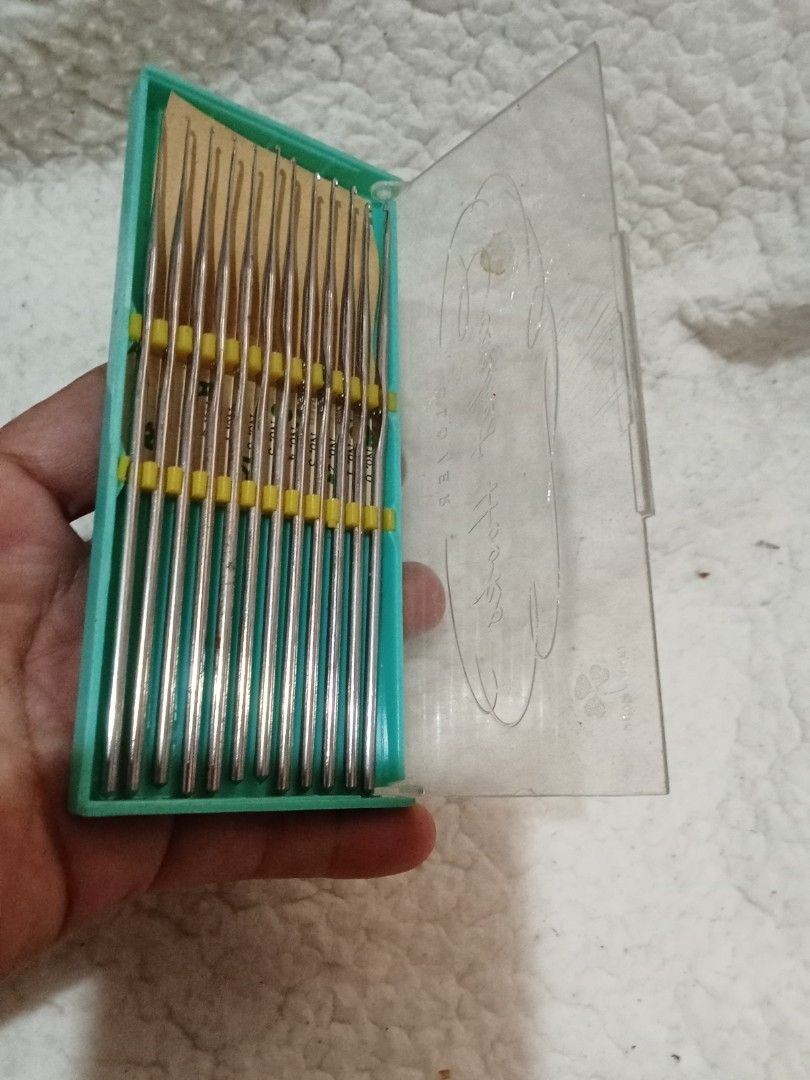 Vintage Crochet Hook Set (Category: Craft Supplies & Tools) located in Bocaue. Submitted by marajapansurplus (Listing ID 1429548671, Image 2). Description: Vintage set of crochet hooks. The set includes multiple hooks of varying sizes, neatly organized in a green plastic case with a clear lid. The case has a yellow band to hold the hooks in place. Perfect for crochet enthusiasts..