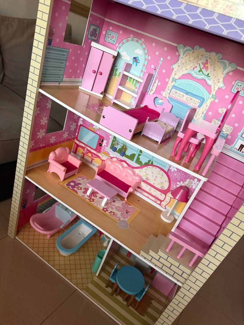 Wooden Big Doll House (Category: Kids Toys) located in Las Pinas. Submitted by a_madz (Listing ID 1429586222, Image 2). Description: Slightly nego Size: Height: 46 inches Length: 29 inches Width: 12 inches With flaws, stains on 2nd and 3rd floor ( pls check photos) You can pick up at BF Resort Village or book shipping. Buyer will shoulder shipping fee..