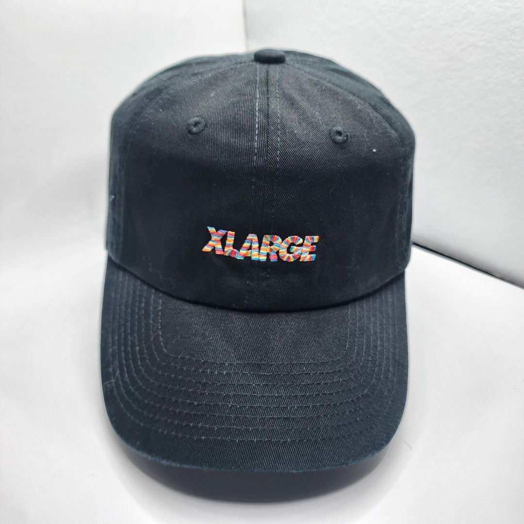 X-Large Cap (Category: Caps & Hats) located in Quezon City. Submitted by randomthangz (Listing ID 1429577567, Image 1). Description: Black cap with the X-Large logo embroidered on the side. Features a curved brim and an adjustable strap at the back. The interior has X-Large branding on the seams..