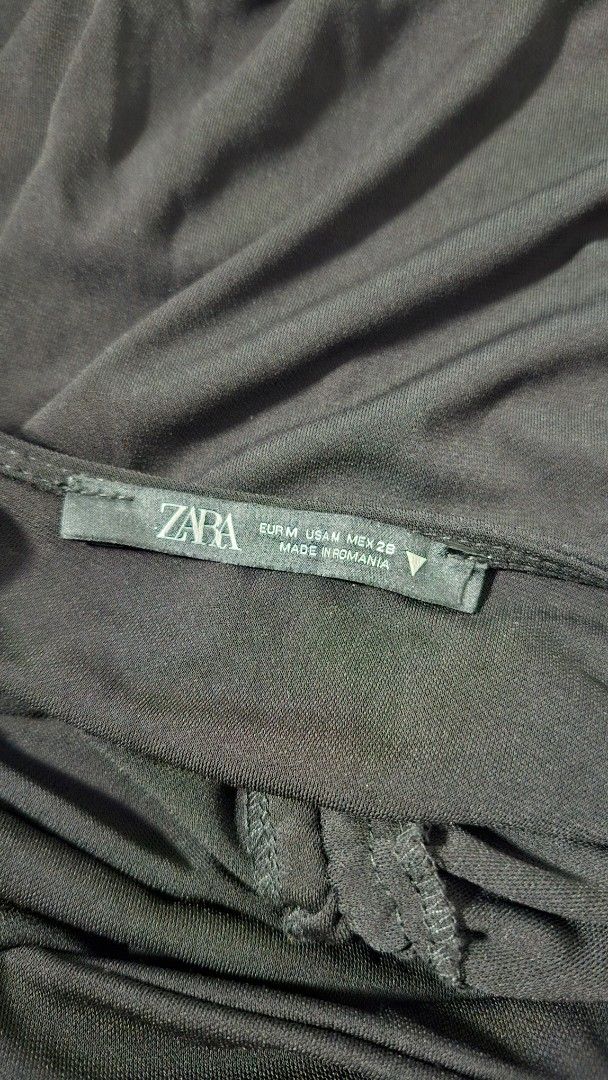 Zara Black Dress - with slit (Category: Dresses) located in Manila. Submitted by prewuvbyjem (Listing ID 1429542894, Image 2). Description: Black dress from Zara. Features a ruched detail on the front. The dress has a zipper closure. Size M. Made in Romania. - used only once. does not fit me anymore. 2495 orig price.