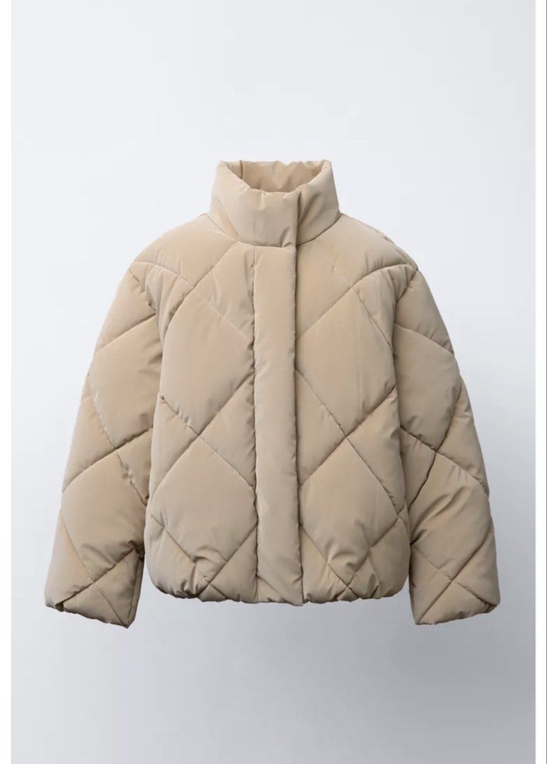 Zara Puffer Jacket (Category: Coats, Jackets and Outerwear) located in Mandaluyong City. Submitted by declutteringcorner (Listing ID 1429665797, Image 1). Description: Zara Puffer Jacket - camel color - check photos for the size - used twice .