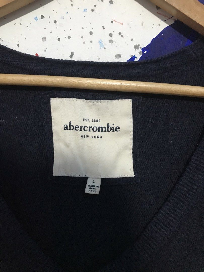 Abercrombie V-Neck Sweater - Navy Blue - Large (Category: Longsleeves) located in Bulacan. Submitted by mission022 (Listing ID 1431234062, Image 3). Description: Navy blue Abercrombie V-neck sweater, size Large. Features the Abercrombie logo. Made in Hong Kong..