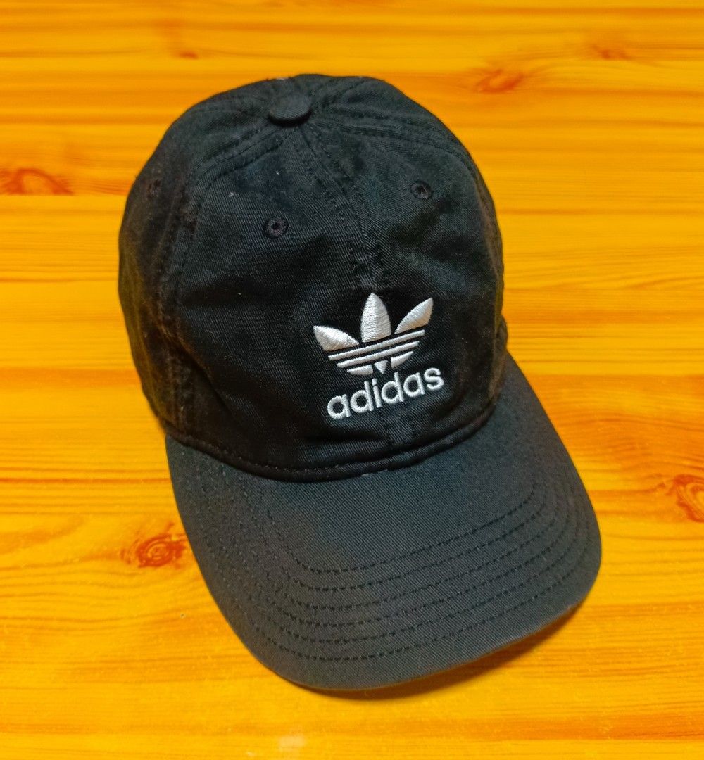 Adidas Cap (Category: Caps & Hats) located in Manila. Submitted by caps08 (Listing ID 1431232580, Image 1). Description: - Black Adidas cap - Embroidered trefoil logo - Adjustable strap - Striped interior lining with Adidas branding - Made of cotton.