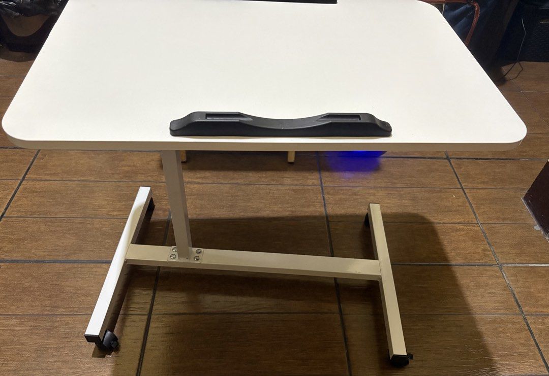 Adjustable Folding Laptop Side Work Table with Wheels (Category: Tables & Sets) located in Mandaluyong City. Submitted by cosmopolly123 (Listing ID 1431305500, Image 1). Description: Foldable and height adjustable table for sale. Just received and assembled today (April 10). Only been used once to check laptop size. RFS: size is too big for room Location: Mandaluyong or nearby areas Shipping fee will be shouldered by the buyer.