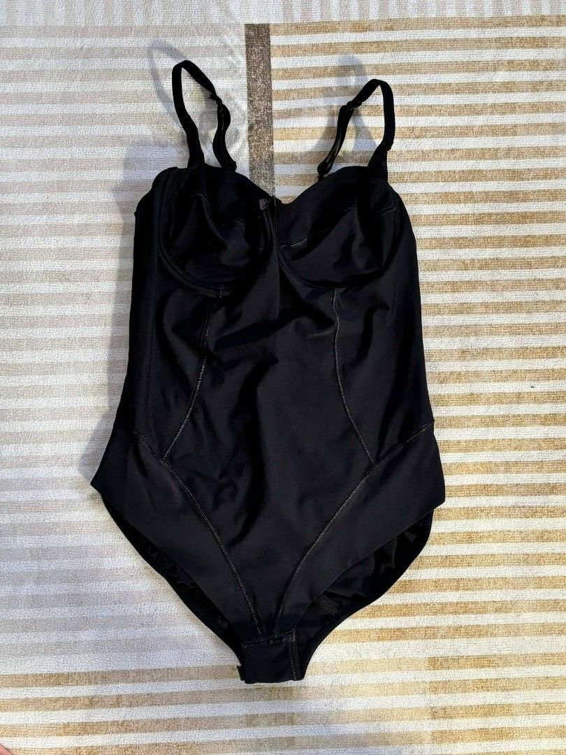 Black Bodysuit with Adjustable Straps (Category: Others Tops) located in Manila. Submitted by _sofetch (Listing ID 1431262719, Image 1). Description: - Adjustable straps - Built-in bra with underwire - Snap closure at crotch - Stretchy, comfortable material - Great for layering or wearing alone.