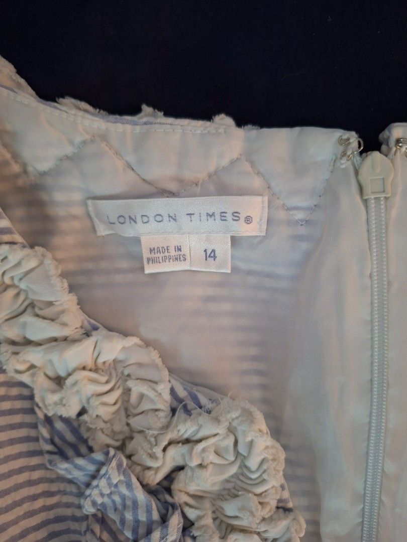 Branded Sleeveless Dress Size 14 (Category: Dresses) located in Mandaue City. Submitted by fsmfsm (Listing ID 1431209416, Image 3). Description: Sleeveless dress from London Times features a blue and white striped pattern. It has a V-neckline with ruffle detailing. The dress is a size 14 and has a zipper closure at the back. -like new - 38.5" x 20" from armpit to armpit - powder blue and white.