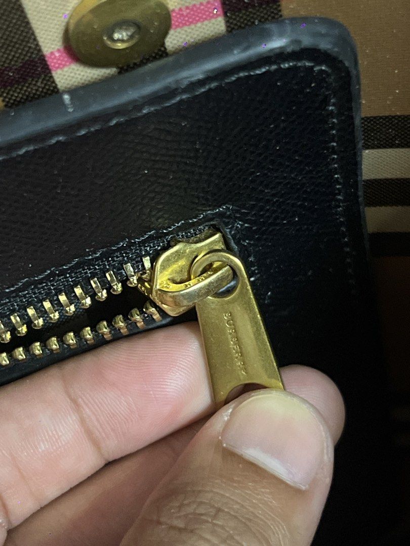 Burberry Black Crest Tote Bag (Category: Luxury Bags & Wallets) located in Quezon City. Submitted by just.loveclub (Listing ID 1431352363, Image 3). Description: - Black Burberry tote bag - Classic design - Gold-tone zipper and hardware - Iconic Burberry check interior - With original tag inside the zipper pocket - YKK zipper - Perfect for work or office - Can fit laptop.