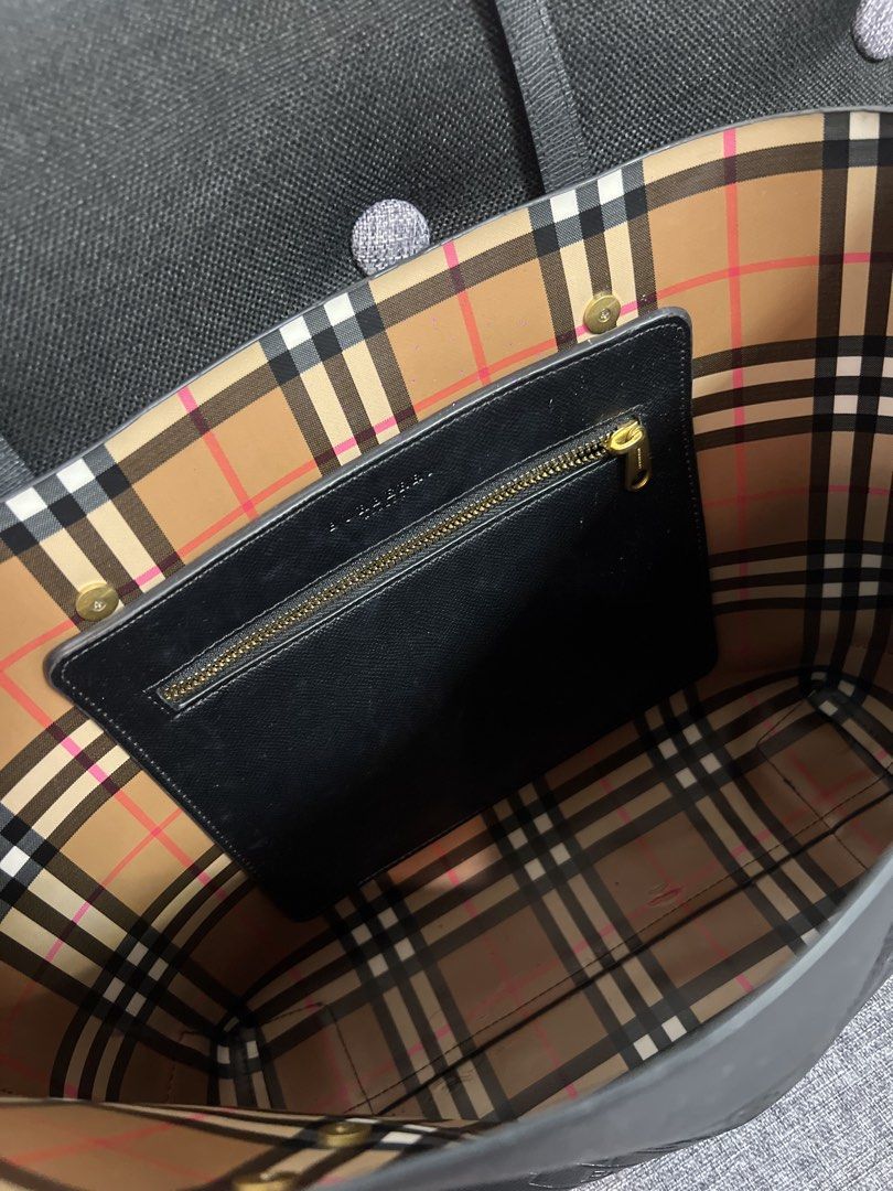 Burberry Black Crest Tote Bag (Category: Luxury Bags & Wallets) located in Quezon City. Submitted by just.loveclub (Listing ID 1431352363, Image 2). Description: - Black Burberry tote bag - Classic design - Gold-tone zipper and hardware - Iconic Burberry check interior - With original tag inside the zipper pocket - YKK zipper - Perfect for work or office - Can fit laptop.