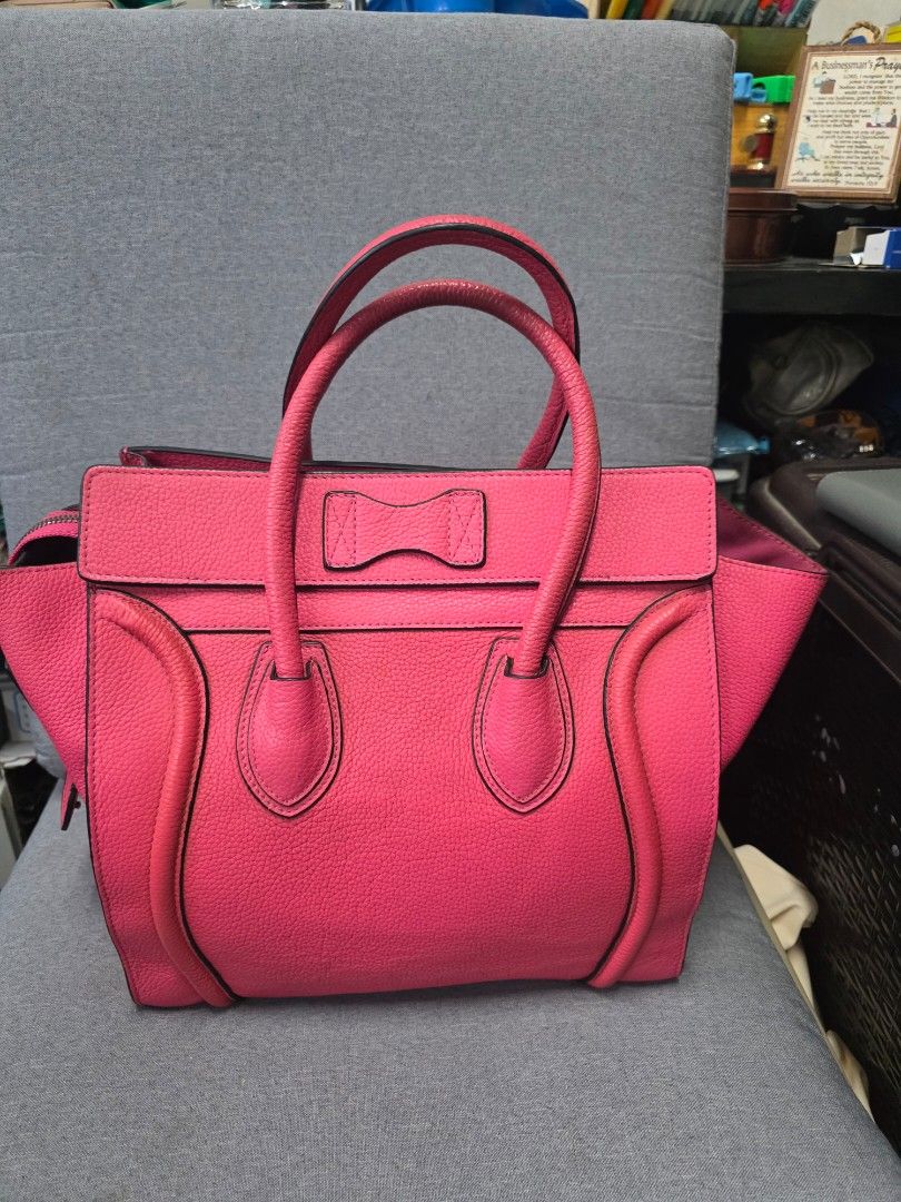 Celine Trapeze Bag - Pink (Category: Luxury Bags & Wallets) located in General Trias. Submitted by roselle2230 (Listing ID 1431302863, Image 2). Description: Authentic Celine Trapeze bag in a vibrant pink color. Features a top handle design with a zip closure and a spacious interior. The bag is made in Italy. The interior includes a zippered pocket and additional compartments for organization. The bag has a structured shape and a classic design..