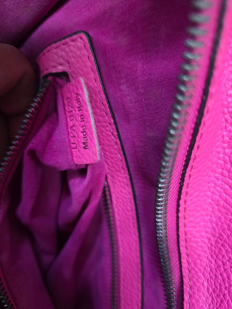 Celine Trapeze Bag - Pink (Category: Luxury Bags & Wallets) located in General Trias. Submitted by roselle2230 (Listing ID 1431302863, Image 3). Description: Authentic Celine Trapeze bag in a vibrant pink color. Features a top handle design with a zip closure and a spacious interior. The bag is made in Italy. The interior includes a zippered pocket and additional compartments for organization. The bag has a structured shape and a classic design..