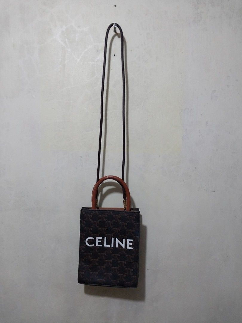 🌰Celine Vertical Cabas Tote Triomphe Mini Satchel (Category: Luxury Bags & Wallets) located in Manila. Submitted by PrinceDani.Clothing (Listing ID 1431231024, Image 3). Description: Celine vertical cabas tote triomphe bag 6.5in width 8in length stamp made in Italy issue: peeled handle see pic vg condition.