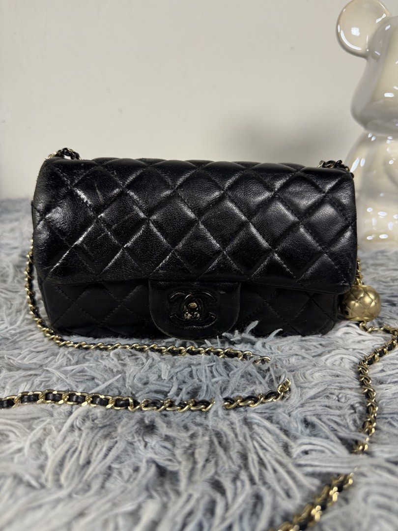 CHANEL Mini Black Lambskin (Category: Luxury Bags & Wallets) located in Cabanatuan. Submitted by retrorewind23 (Listing ID 1431315397, Image 1). Description: CHANEL Mini Black Lambskin Rectangular Pearl Crush Flap Bag Preloved source from Japan Auction.