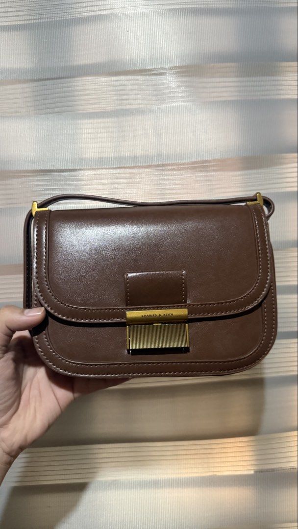 Charles and Keith Brown Charlot Bag (Category: Luxury Bags & Wallets) located in Calamba. Submitted by ashvault (Listing ID 1431273030, Image 1). Description: Charles and Keith Charlot Bag 2-way shoulder sling bag.