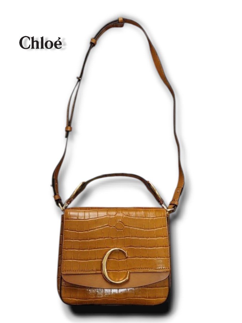 Chloe C Croc-Embossed Shoulder Bag (Category: Luxury Bags & Wallets) located in Cebu City. Submitted by gabgaaab (Listing ID 1431287974, Image 3). Description: Chloé C Mini Shiny Croco-Effect Shoulder Bag - Excellent Condition - Crocodile-embossed calfskin leather - Color: Honey Gold / Sepia Brown - Gold-tone “C” logo and hardware - Interior: Beige canvas lining with one flat pocket - Top handle, adjustable/removable crossbody strap, and push-loc