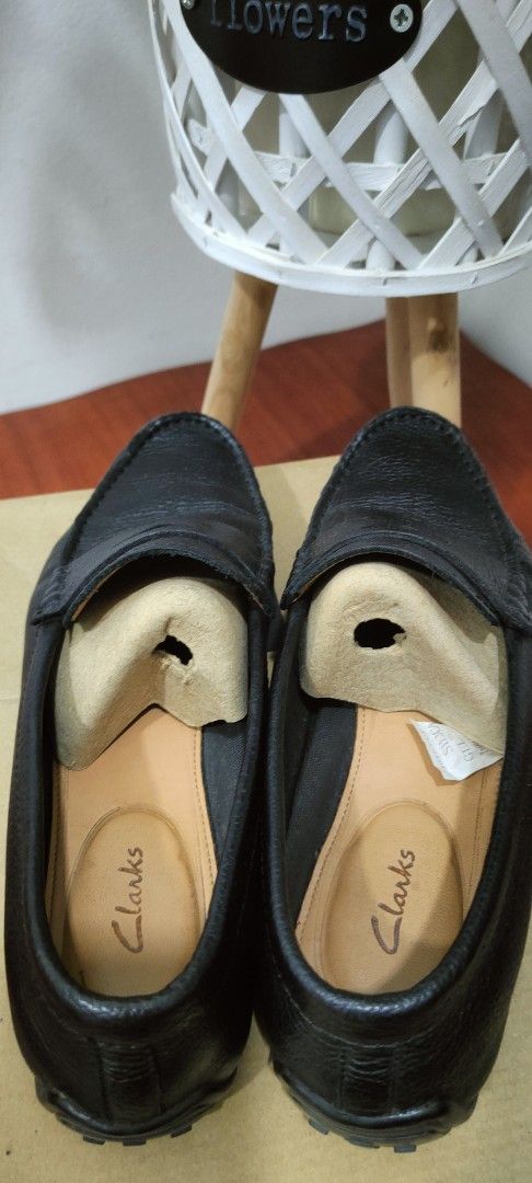 Clarks Black Leather Loafers (Category: Loafers) located in Kuala Lumpur. Submitted by faizasa8957835 (Listing ID 1431334604, Image 3). Description: - Clarks black leather loafers - Slip-on style - Textured leather upper - Comes with original box - Visible wear on soles - Features Clarks logo inside - Timeless and versatile.