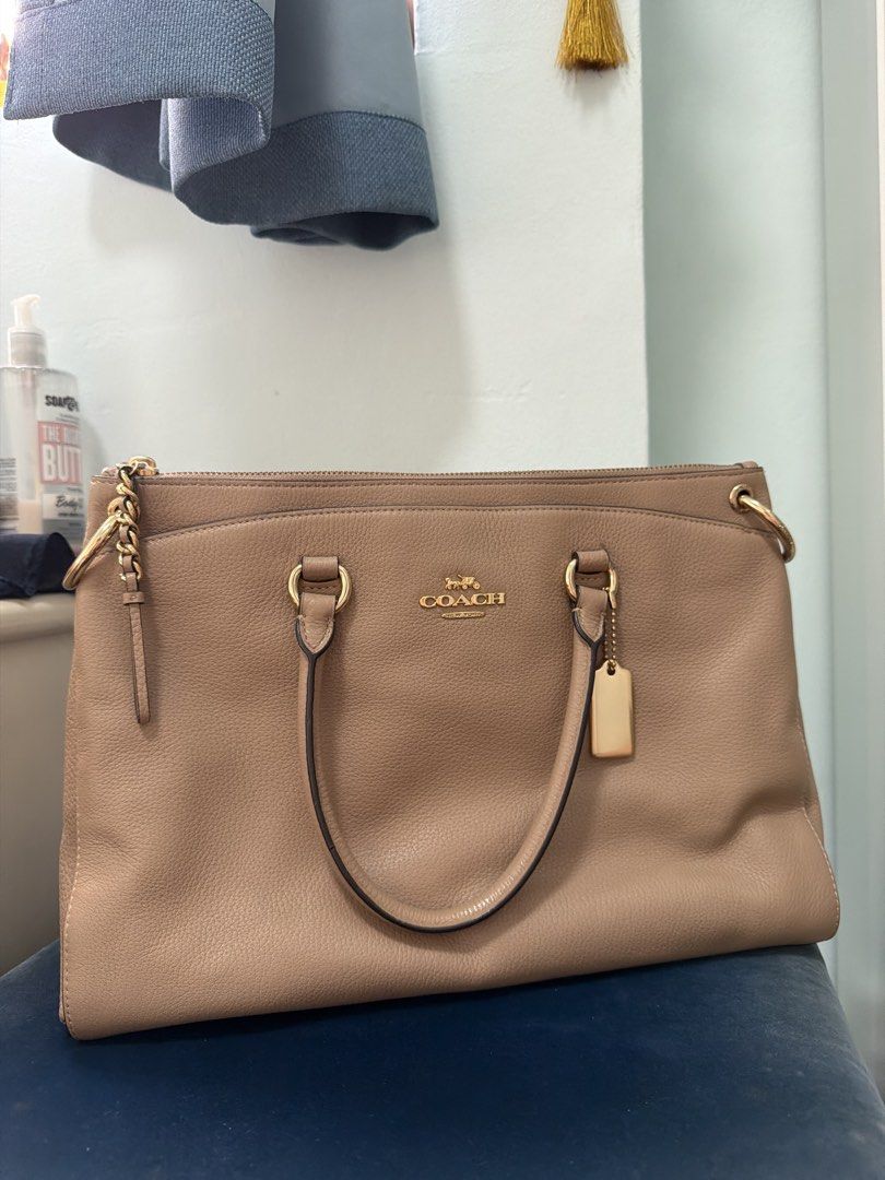 Coach Handbag (Beige) (Category: Bags & Wallets) located in Singapore. Submitted by Basicstuff (Listing ID 1431197078, Image 1). Description: Bought in the states Brand new condition 10/10 but does not come with dust bag, never had a chance to use this because i have too bags meetups only .