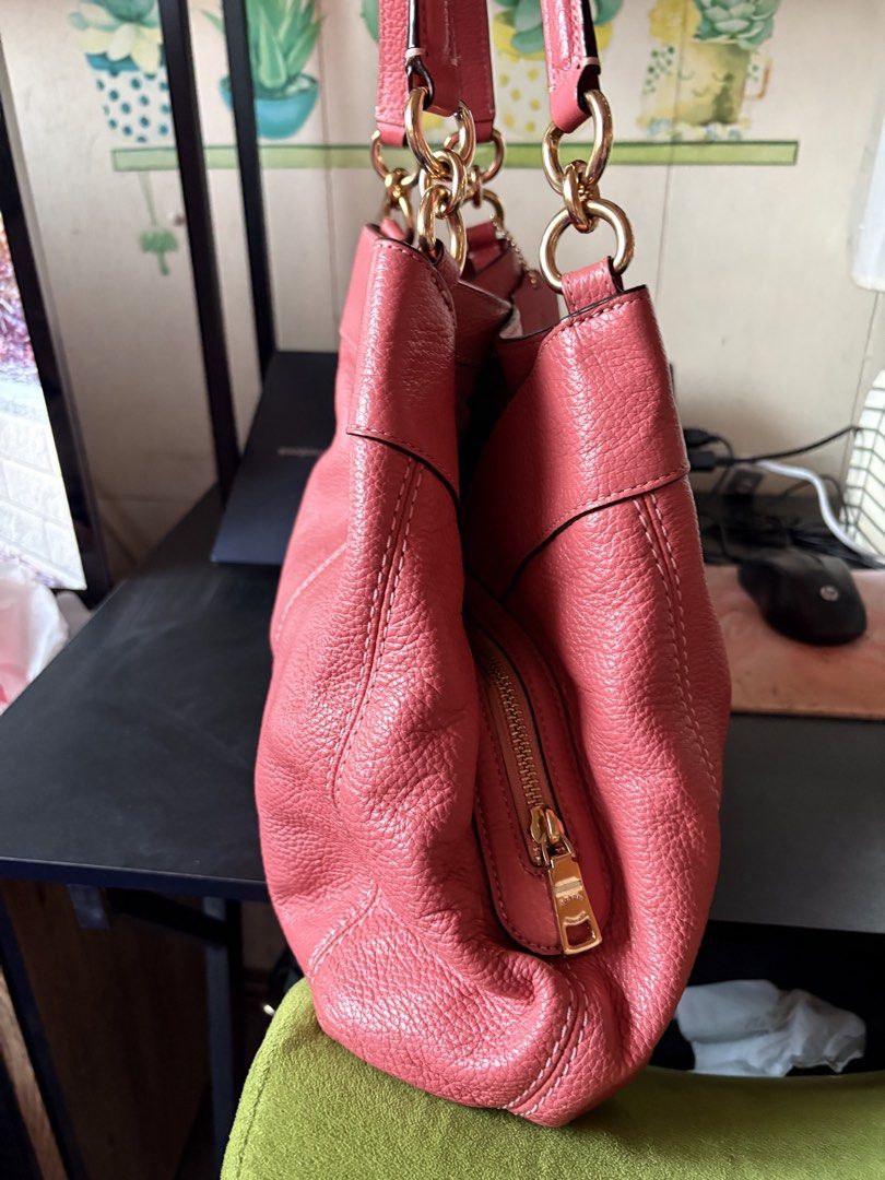 Coach Lexy Pebbled Shoulder Bag in Pink (Category: Luxury Bags & Wallets) located in Manila. Submitted by coopersunset (Listing ID 1431246529, Image 3). Description: Original price bough from seller: ₱5k ✔ Note: There are rubbings inside of the bag, specifically on the creed patch (see photo) ✔ Lightly used, well-maintained ✔ Soft, high-quality pebbled leather ✔ Classic and chic ✔ Three compartment that fits long wallet, phone, makeup pouch, etc.
