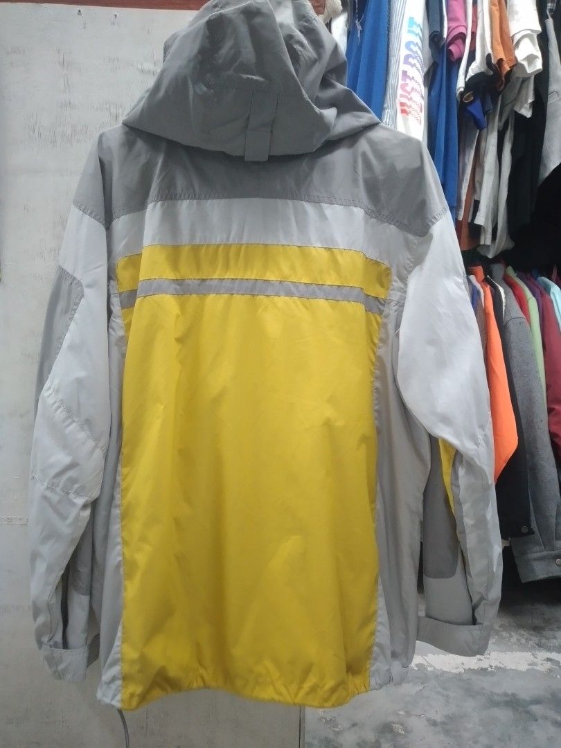 Columbia Waterproof Jacket (Category: Coats, Jackets and Outerwear) located in Solano. Submitted by rosertw_ukay2022 (Listing ID 1431267966, Image 2). Description: - Columbia waterproof jacket - Yellow and gray color scheme - Hooded design - Zipper closure - Multiple pockets - Columbia logo on sleeve - Mesh lining - Ideal for outdoor use.