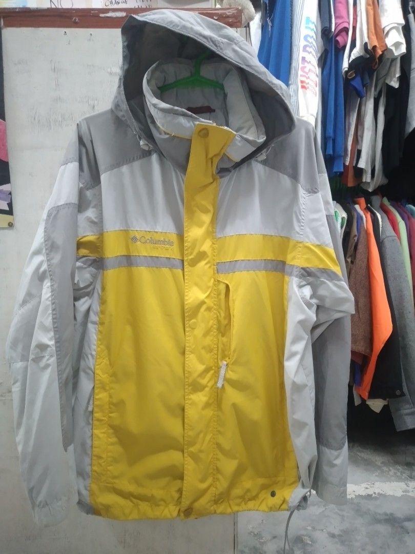 Columbia Waterproof Jacket (Category: Coats, Jackets and Outerwear) located in Solano. Submitted by rosertw_ukay2022 (Listing ID 1431267966, Image 1). Description: - Columbia waterproof jacket - Yellow and gray color scheme - Hooded design - Zipper closure - Multiple pockets - Columbia logo on sleeve - Mesh lining - Ideal for outdoor use.