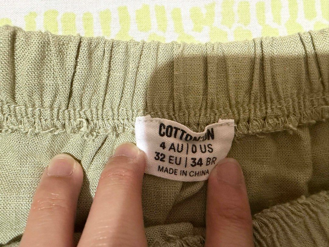Cotton On Tiered Skirt (Category: Skirts) located in Cabuyao City. Submitted by declutter_w_mee (Listing ID 1431271794, Image 2). Description: Cotton On olive green tiered skirt. Size 4 AU/US. Features elastic waistband and drawstring..