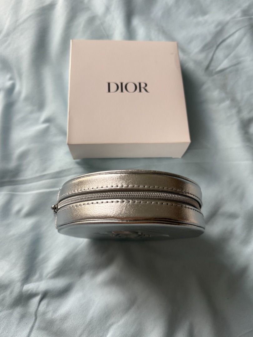 Dior Silver Cosmetic Case - VIP Gift (Category: Luxury Bags & Wallets) located in Quezon City. Submitted by pigletguadalupe (Listing ID 1431226501, Image 3). Description: - Authentic Dior cosmetic case - Silver exterior - Zipper closure - Dior logo on front - Includes original white box.