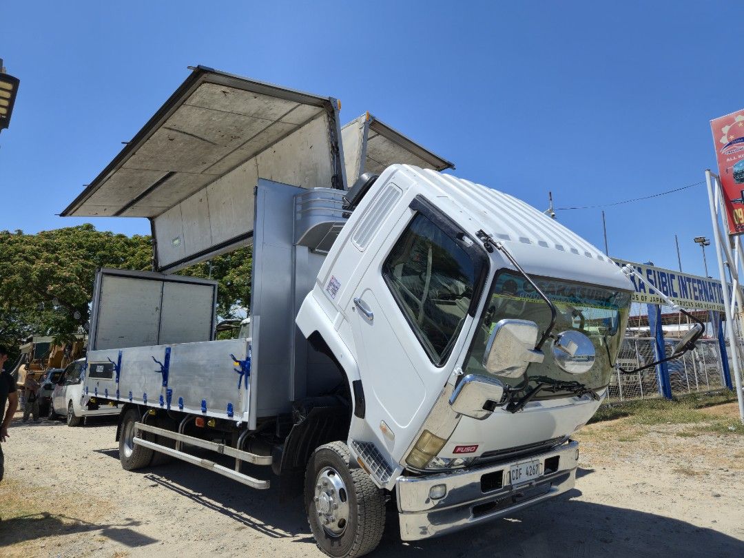 FUSO FIGTHER WINGVAN 6M60 (Category: Heavy Vehicles) located in Manila. Submitted by samansubic (Listing ID 1431187861, Image 3). Description: FUSO FIGHTER WINGVAN, 6M60, 8STUD, 22ft, 2025 year model. Japan Surplus Trucks for sale. Osaka Subic International Inc. Jasa Road, Purok 2, Concepcion, Lubao, Pampanga. For inquiries: call or message 09199977999/09177799955. We accept: Cash/Bank Financing..