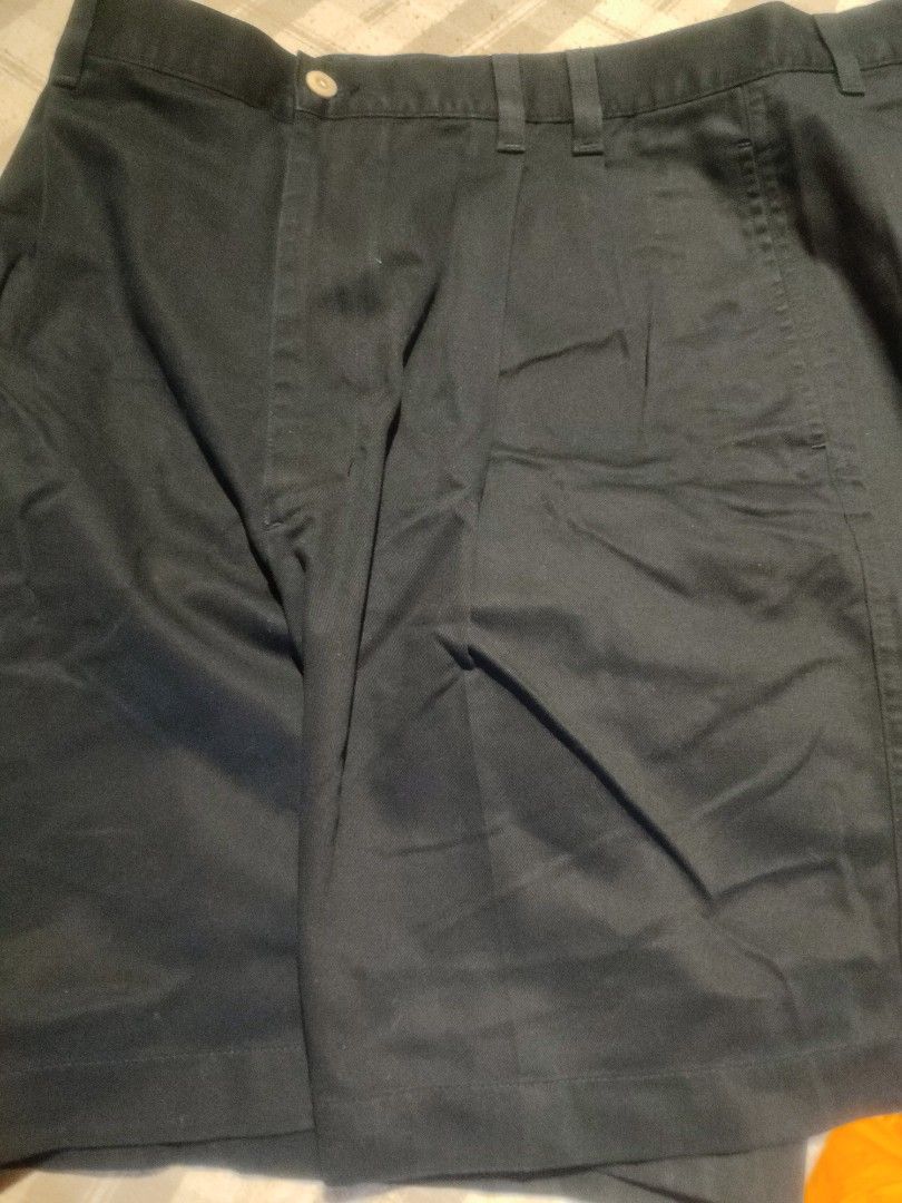 Greg Norman Golf Pants - Waist 36 (Category: Trousers) located in Baler. Submitted by onlyhuman_67 (Listing ID 1431349555, Image 2). Description: This is a pre-owned item but in very good condition. Picture may differ from actual color due to lighting. - Greg Norman golf pants - Size: 36 - Material: 100% cotton - Closure: Button - Design: Embroidered shark logo on pocket - Origin: Made in Indonesia - Color: Dark Navy.