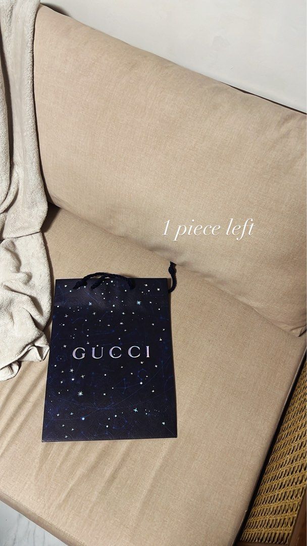 Gucci Paper Bag (Category: Luxury Bags & Wallets) located in Manila. Submitted by monicagellerbing__ (Listing ID 1431311382, Image 1). Description: - Authentic Gucci paper bag - Dark blue exterior with constellation design - Features the Gucci logo - Includes black rope handles - Perfect for gifting or collecting - One piece available.