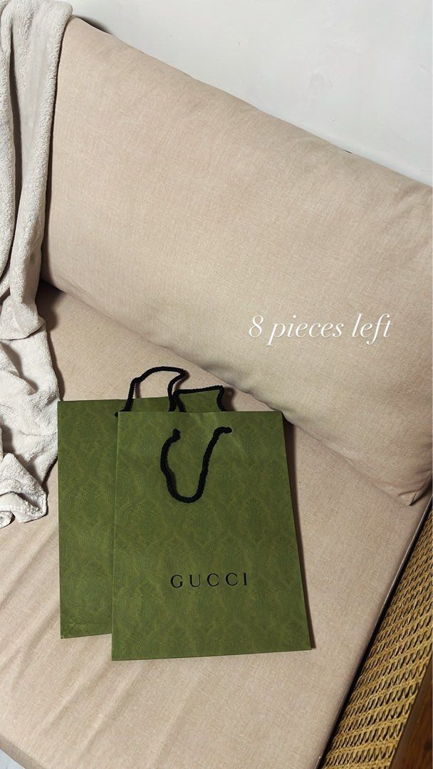 Gucci Shopping Bag (Category: Luxury Bags & Wallets) located in Manila. Submitted by monicagellerbing__ (Listing ID 1431311162, Image 1). Description: - Authentic Gucci shopping bag - Features a green exterior - Includes the Gucci logo - Black rope handles - 8 pieces available - Perfect for gifting or collecting.