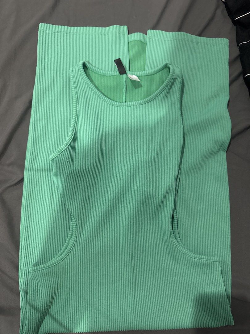 H&M Ribbed Sleeveless Dress (Category: Dresses) located in Manila. Submitted by absdeclutter (Listing ID 1431222677, Image 1). Description: - Light green midi dress - Ribbed texture - Round neckline - Fitted silhouette - Side pockets - Stretchy material.