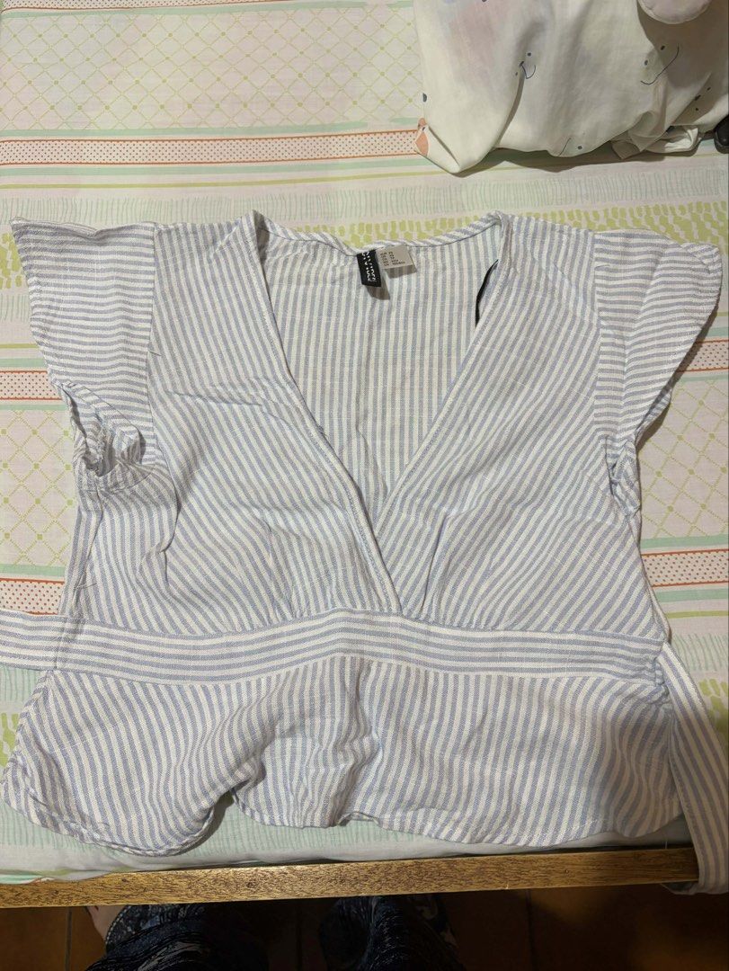 H&M Striped Wrap Top (Category: Blouses) located in Cabuyao City. Submitted by declutter_w_mee (Listing ID 1431272126, Image 1). Description: can tie the back to make it more fitted.
