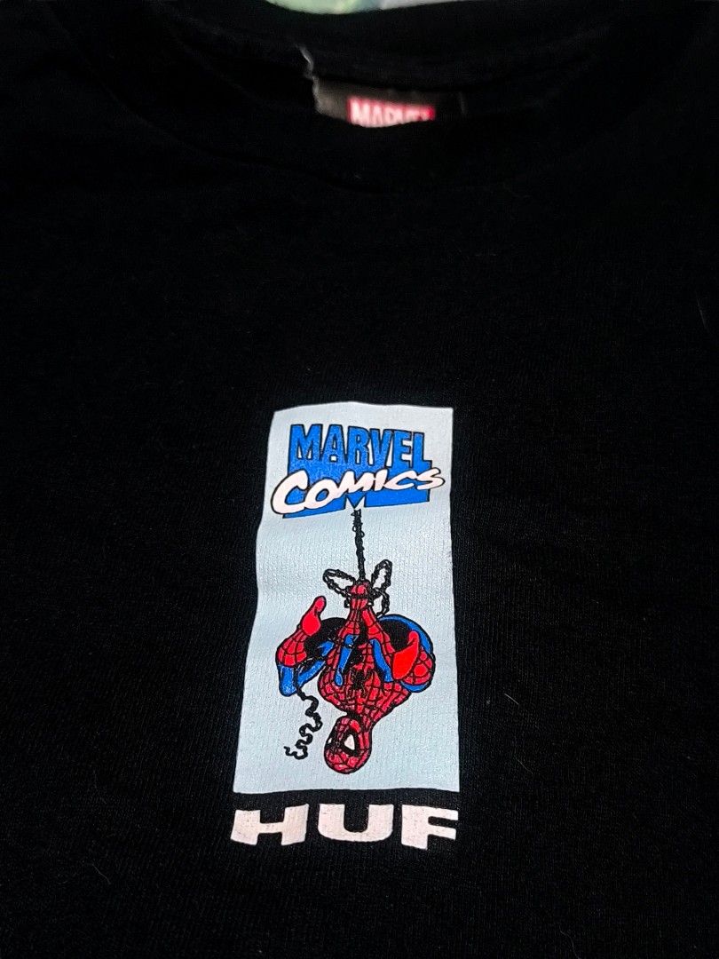 HUF Marvel Spider-Man T-Shirt SALE/SWAP (Category: Tshirts & Polo Shirts ) located in Muntinlupa City. Submitted by narymadine_ (Listing ID 1431278433, Image 3). Description: Black HUF t-shirt featuring a Spider-Man graphic on the front and back. The shirt has a Marvel Comics logo on the tag. It is a size medium. The shirt has a crew neck and short sleeves. The graphic on the front shows Spider-Man swinging. The back graphic shows a different Spi
